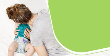 Banner della pagina Inizia con i pannolini lavabili con una mamma ed il suo bambino